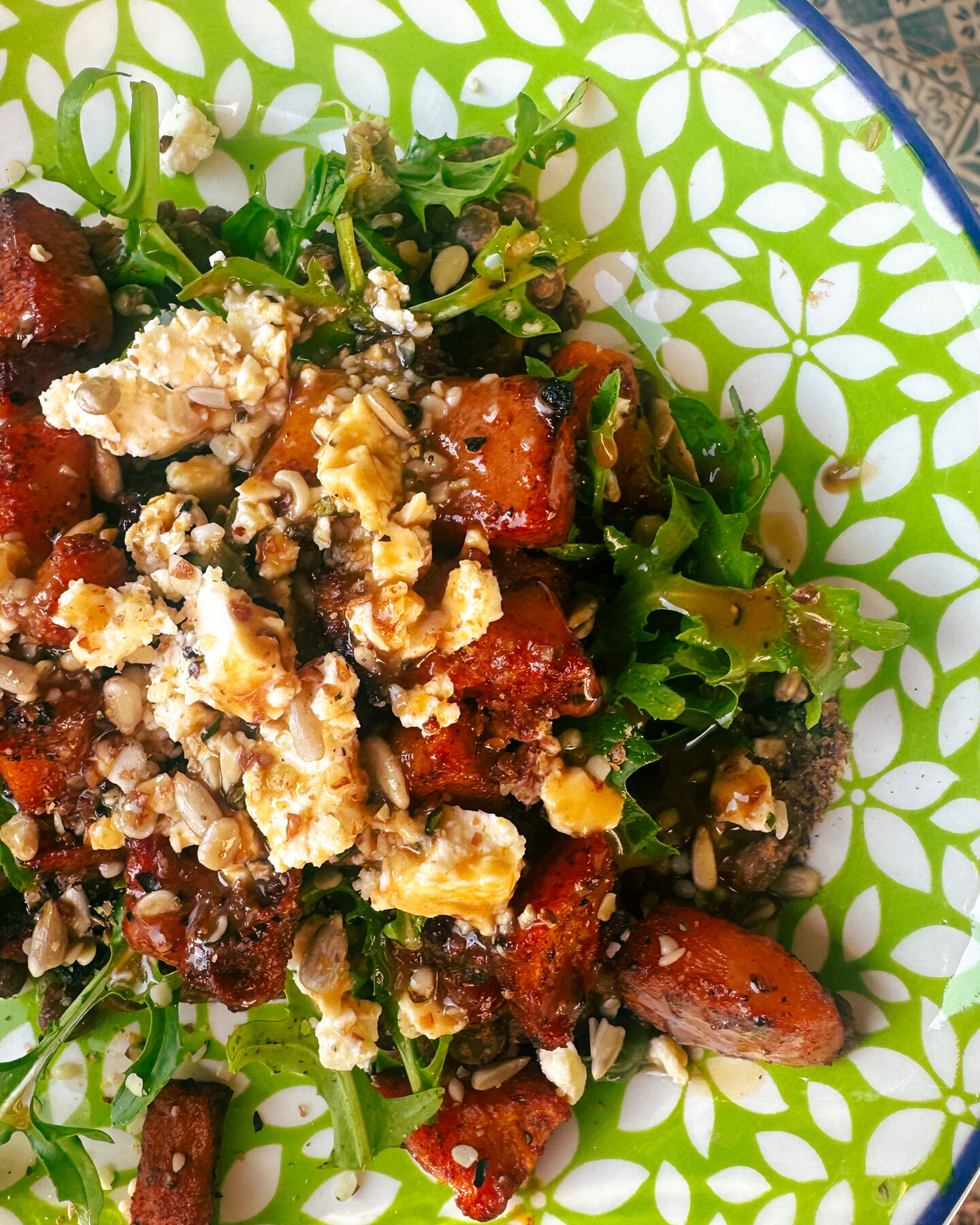 Roasted butternut and warm lentil bowl with feta, rocket and balsamic dressing