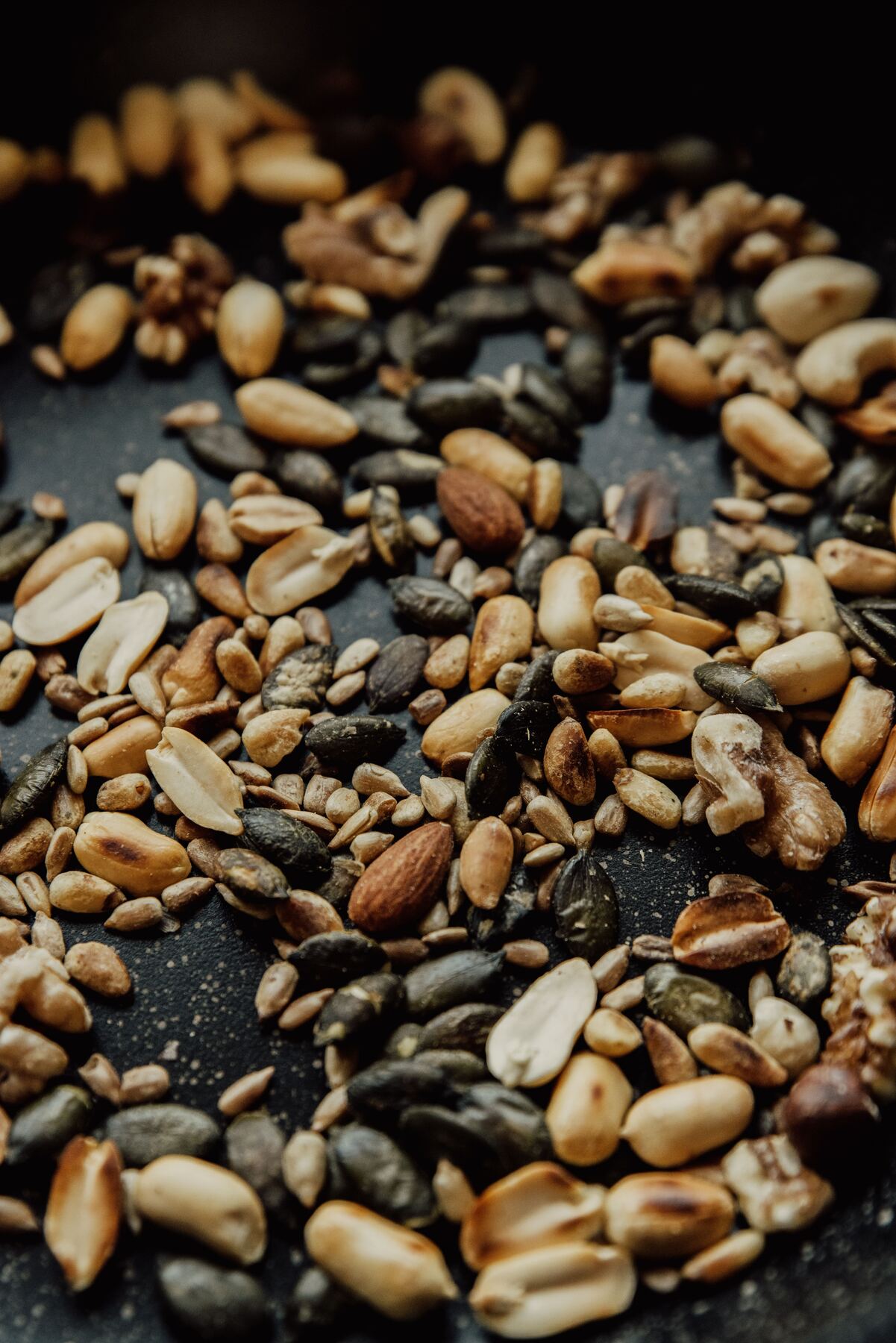 Seeds roasting in a pan, golden and fragrant
