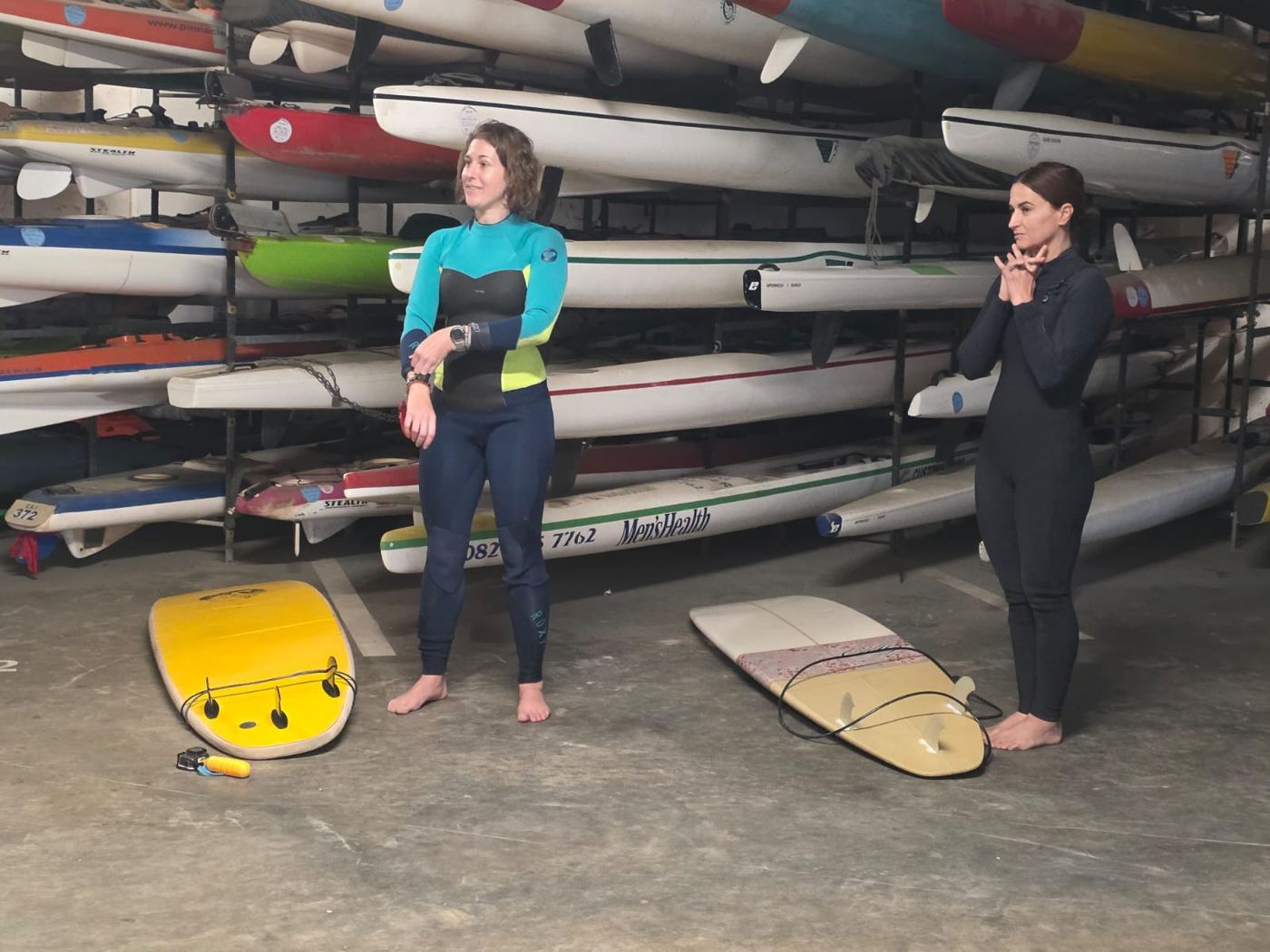 Getting fitted for wetsuits before the surf lesson
